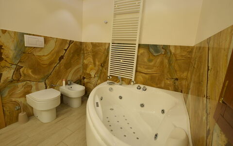 Villa Monaco: Flooring, Interior Design, Floor, Plumbing Fixture, Lighting, Bathroom, Room, Ceiling, Bathtub, Plumbing