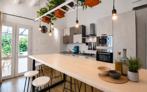 Villa Didymos: Furniture, Interior Design, Flooring, Kitchen, Wall, Light Fixture, Wood, Countertop, Ceiling, Floor