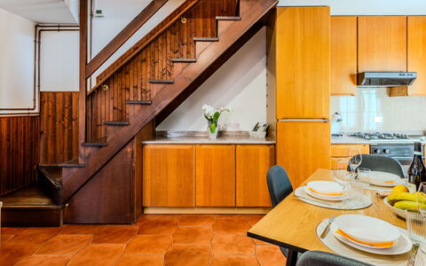 Casa Gloria: Kitchen, Flooring, Wood, Interior Design, Floor, Major Appliance, Countertop, Kitchen Appliance, Orange, Room