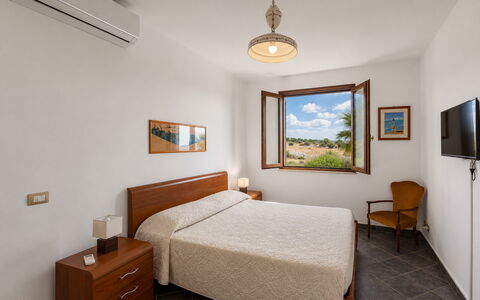 Villa Don Pino: Apartment, Wood Stain, Hardwood, Bed Frame, Hotel, Picture Frame, Bed, Bedroom, Nightstand, Suite