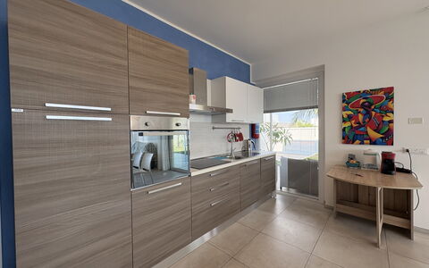 A Casa di Gio: Flooring, Kitchen Appliance, Kitchen, Major Appliance, Interior Design, Wood, Cabinetry, Countertop, Floor, Furniture