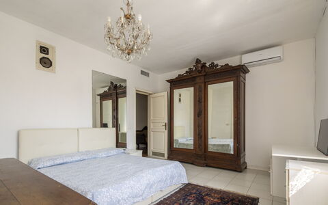 Villa Eva: Bed, Furniture, Bedroom, Interior Design, Floor, Flooring, Bed Sheet, Wood, Bedding, Room