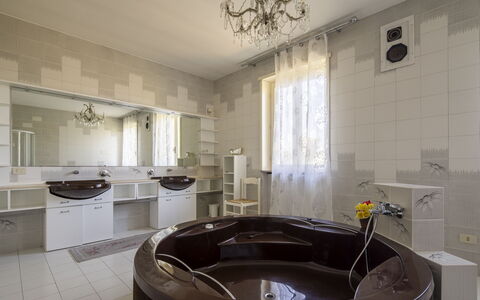 Villa Eva: Flooring, Floor, Plumbing Fixture, Interior Design, Bathtub, Plumbing, Ceiling, Lighting, Bathroom, Room