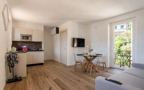 Next Comacina, Lago di Como with Garage: Furniture, Flooring, Apartment, Chair, Wood Flooring, Hardwood, Houseplant, Wood Stain, Living Room, Balcony
