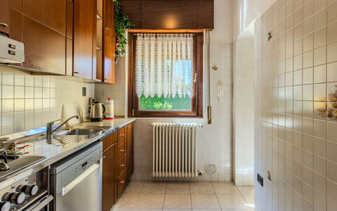 Villa Giulia: Kitchen, Wood, Flooring, Kitchen Appliance, Countertop, Major Appliance, Interior Design, Floor, Cabinetry, Kitchen Sink