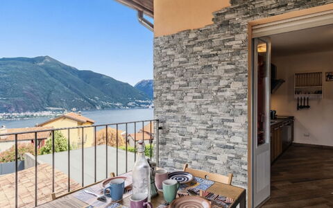 Casa Matilde: Chair, Mountain Range, Kitchen & Dining Room Table, Coast, Balcony, Wood Stain, Houseplant, Outdoor Furniture, Coffee Table, Home Door