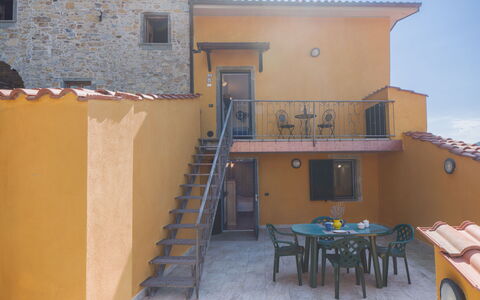Casa Morgana: Wall, Architecture, Door, Balcony, Stairs, Handrail, Wood Stain, Houseplant, Flowerpot, Baluster