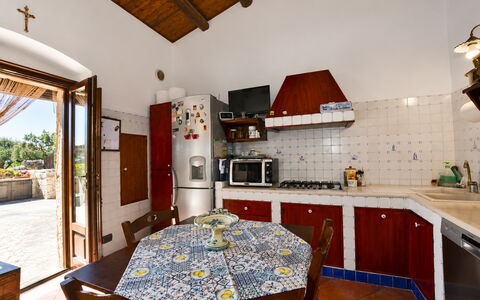 La Muraglia: Flooring, Furniture, Floor, Door, Chair, Wood Stain, Kitchen, Kitchen & Dining Room Table, Tile, Houseplant