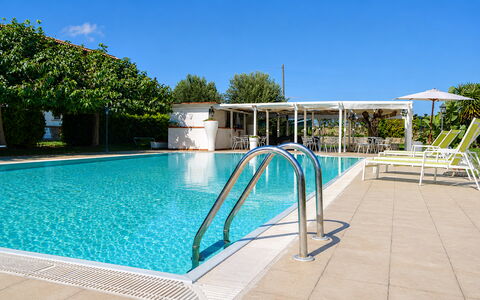 Villa Gertrude: Swimming Pool, Resort, Composite Material, Shade, Leisure, Outdoor Furniture, Eco Hotel, Hotel, Leisure Centre, Sunlounger