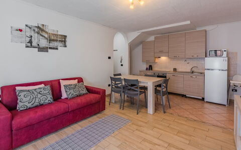 Stefani: Furniture, Flooring, Interior Design, Floor, Couch, Room, Apartment, Ceiling, Table, Living Room