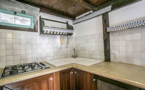 Casa Dafne: Kitchen, Flooring, Interior Design, Ceiling, Kitchen Sink, Countertop, Floor, Major Appliance, Kitchen Stove, Kitchen Appliance