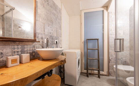 Noah: Flooring, Wall, Floor, Interior Design, Plumbing Fixture, Wood, Bathroom, Ceiling, Lighting, Room