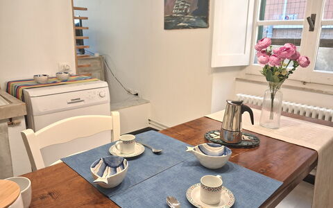 La Riva - Levanto: Furniture, Table, Wood, Tableware, Interior Design, Kitchen & Dining Room Table, Serveware, Chair, Flooring, Dining Room