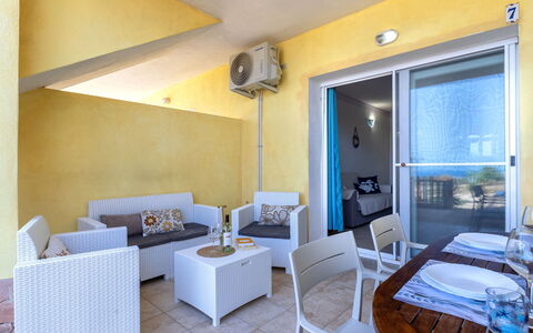 Sunset House Isola Rossa: Blue, Balcony, Handrail, Apartment, Fence, Sea, Resort, Condominium, Swimming Pool, Hotel
