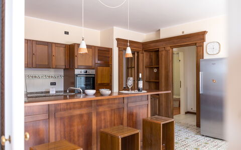 Villa Althea: Flooring, Countertop, Cabinetry, Wood, Interior Design, Furniture, Kitchen, Floor, Ceiling, Cupboard