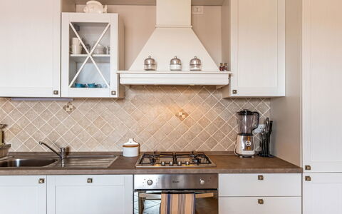 Vacanze Levante: Kitchen, Wood, Interior Design, Cabinetry, Flooring, Countertop, Kitchen Stove, Kitchen Appliance, Light Fixture, Ceiling
