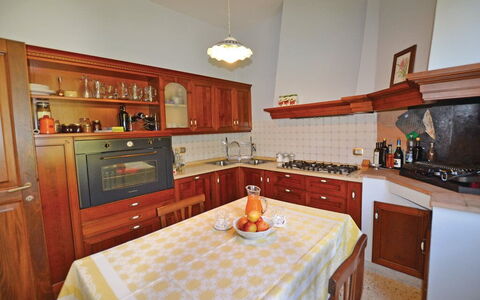 Villa Santa Chiara: Kitchen, Furniture, Cabinetry, Interior Design, Kitchen Appliance, Wood, Countertop, Flooring, Major Appliance, Room