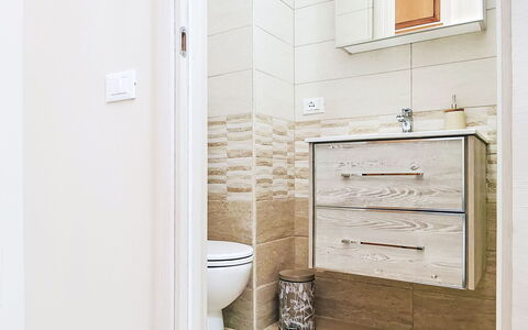 La Terrazza di Caramanico: Flooring, Plumbing Fixture, Floor, Bathroom, Bathroom Cabinet, Toilet, Plumbing, Cabinetry, Room, Sink