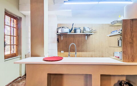 La Perla di Aprilia: Wall, Interior Design, Wood, Flooring, Ceiling, Countertop, Floor, Lighting, Furniture, Kitchen