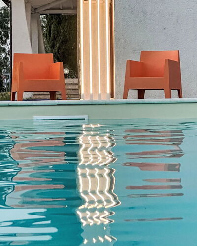 La Perla di Aprilia: Orange, Swimming Pool, Wood Stain, Outdoor Furniture, Outdoor Structure