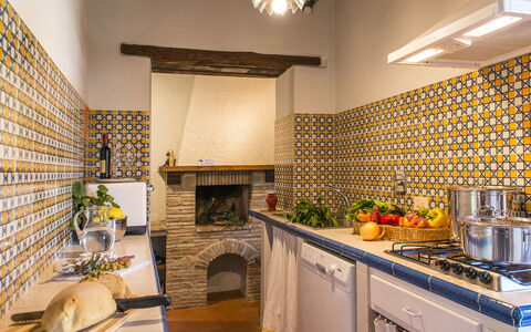 Casa Torrione 14: Yellow, Interior Design, Flooring, Tile, Kitchen, Floor, Room, Ceiling, Kitchen Stove, Countertop