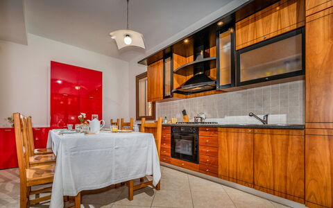 Villa delle Sirene 6: Flooring, Wood, Interior Design, Floor, Kitchen, Ceiling, Room, Cabinetry, Lighting, Major Appliance