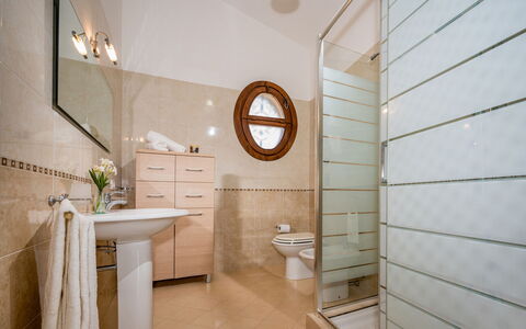 Villa delle Sirene 6: Flooring, Interior Design, Floor, Plumbing Fixture, Bathroom, Lighting, Mirror, Plumbing, Room, Home