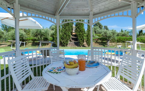 Il Podere di Fi 8: Furniture, Outdoor Furniture, Chair, Garden, Shade, Gazebo, Outdoor Structure, Outdoor Table, Porch, Patio