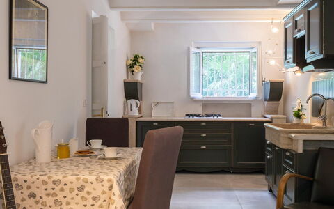 Villa Corona 8: Furniture, Interior Design, Countertop, Kitchen, Kitchen Appliance, Wood, Ceiling, Lighting, Light Fixture, Cabinetry