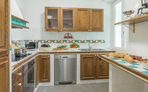 Villa Rasena 6: Kitchen, Wood, Countertop, Interior Design, Cabinetry, Furniture, Flooring, Kitchen Appliance, Major Appliance, Room