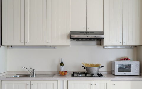 Arcimboldo House 2+2: Kitchen, Kitchen Appliance, Cabinetry, Interior Design, Wood, Countertop, Furniture, Major Appliance, Lighting, Home