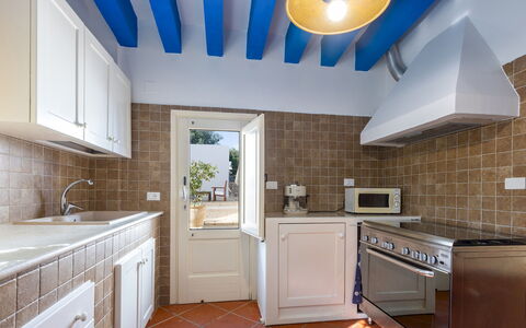 Villa del Lentisco 8+2: Kitchen, Countertop, Major Appliance, Kitchen Appliance, Flooring, Interior Design, Cabinetry, Floor, Furniture, Home