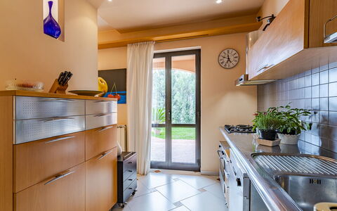 Villa Elda 6: Kitchen, Countertop, Interior Design, Furniture, Flooring, Wood, Kitchen Appliance, Cabinetry, Major Appliance, Home