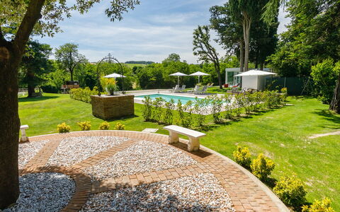 La Casa di Nanì 8: Shrub, Garden, Swimming Pool, Lawn, Resort, Shade, Umbrella, Landscaping, Outdoor Furniture