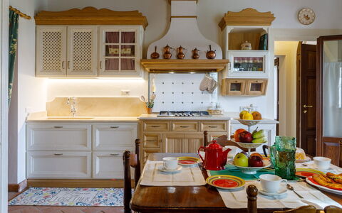 Ca' Pellicciano 8: Furniture, Interior Design, Kitchen, Cabinetry, Wood, Flooring, Countertop, Room, Lighting, Cupboard