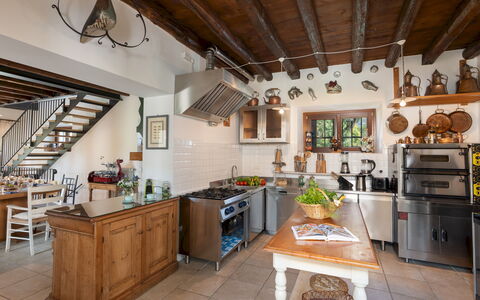 Villa Barchessa Panigai 8: Furniture, Kitchen, Interior Design, Wood, Countertop, Cabinetry, Flooring, Kitchen Appliance, Home, Chair