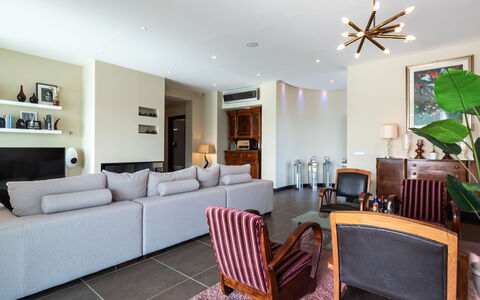Villa Atmosfere 8: Furniture, Interior Design, Flooring, Floor, Couch, Room, Living Room, Wood, Ceiling, Table