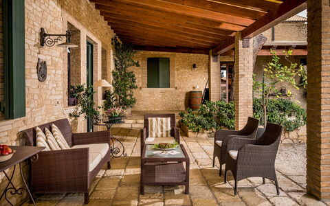 Villa Terra del Sole 8: Furniture, Chair, Outdoor Furniture, Wood, Table, Interior Design, Flooring, Porch, Floor, Flowerpot