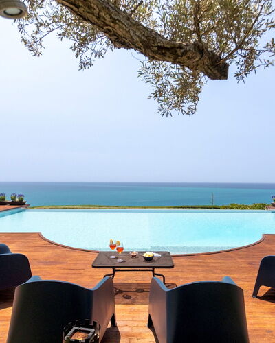 Villa Terra del Sole 8: Water, Swimming Pool, Resort, Furniture, Sea, Outdoor Furniture, Eco Hotel, Ocean, Dusk, Sunset