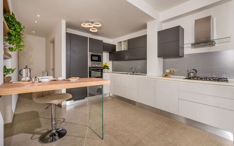 Dama dei Venti 6+2: Kitchen, Countertop, Kitchen Appliance, Furniture, Interior Design, Cabinetry, Flooring, Major Appliance, Wood, Ceiling