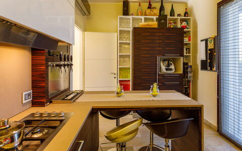 Villa Alais 8: Furniture, Interior Design, Kitchen, Countertop, Kitchen Appliance, Cabinetry, Flooring, Wood, Major Appliance, Ceiling