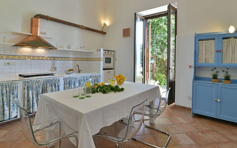 Villa Afrodite 8: Furniture, Interior Design, Flooring, Table, Floor, Kitchen, Lighting, Room, Kitchen & Dining Room Table, Chair