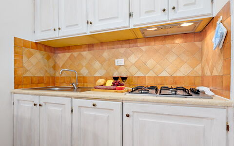 Casa Maestrale 6: Kitchen, Countertop, Wood, Interior Design, Major Appliance, Flooring, Kitchen Appliance, Floor, Cabinetry, Room