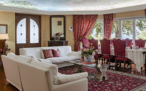 Villa Eden 8: Furniture, Interior Design, Couch, Flooring, Table, Red, Living Room, Floor, Chair, Ceiling