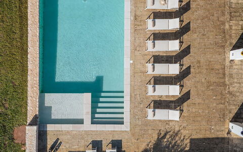 Opuntia Trulli e Lamie 10: Swimming Pool, Composite Material, Resort, Concrete, Outdoor Furniture, Design, Shade, Tile, Chair, Sunlounger