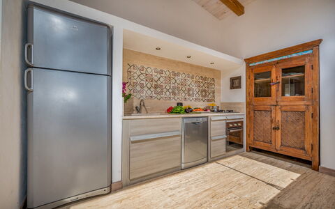 Villa Pineta 6: Kitchen, Countertop, Flooring, Wood, Cabinetry, Furniture, Interior Design, Major Appliance, Kitchen Appliance, Floor
