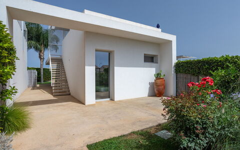 Villa Il Melograno 4+2: Wall, Architecture, Residential Area, Home, Composite Material, Shade, Concrete, Estate, Garden, Landscaping