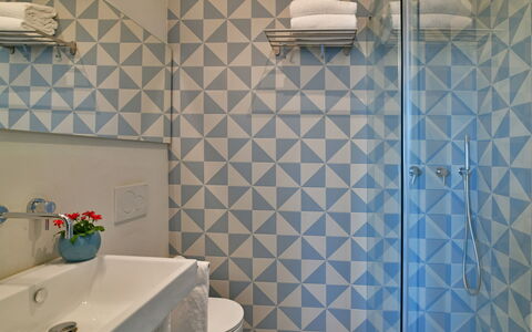 Villa Mandorlo 4: Blue, Interior Design, Flooring, Floor, Ceiling, Tile, Room, Bathroom, Plumbing Fixture, Light Fixture