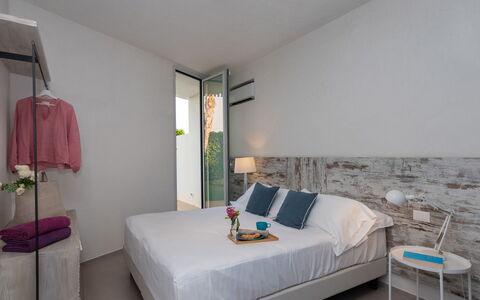 Villa Mandorlo 4: Bed, Bedroom, Furniture, Wall, Interior Design, Flooring, Wood, Bedding, Floor, Bed Sheet