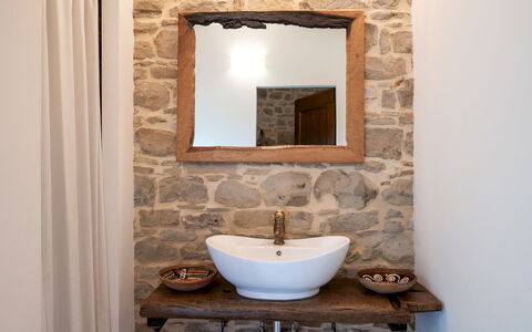 Villa Cherubini 8+1: Wall, Interior Design, Mirror, Plumbing Fixture, Bathroom Sink, Bathroom, Lighting, Stone Wall, Room, Sink